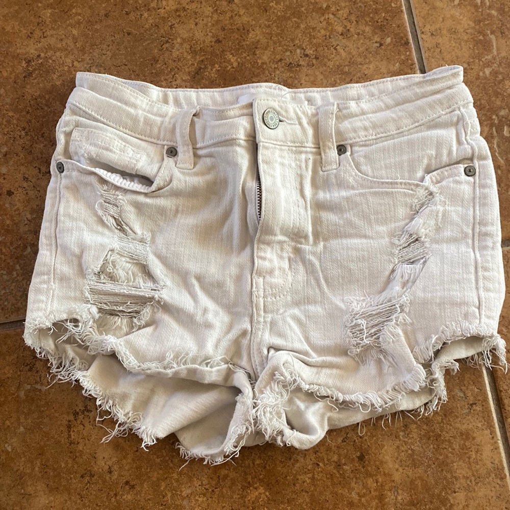 White distressed denim shorts